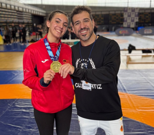 Encarni Méndez junto a su entrenador Encarni Méndez junto a su entrenador